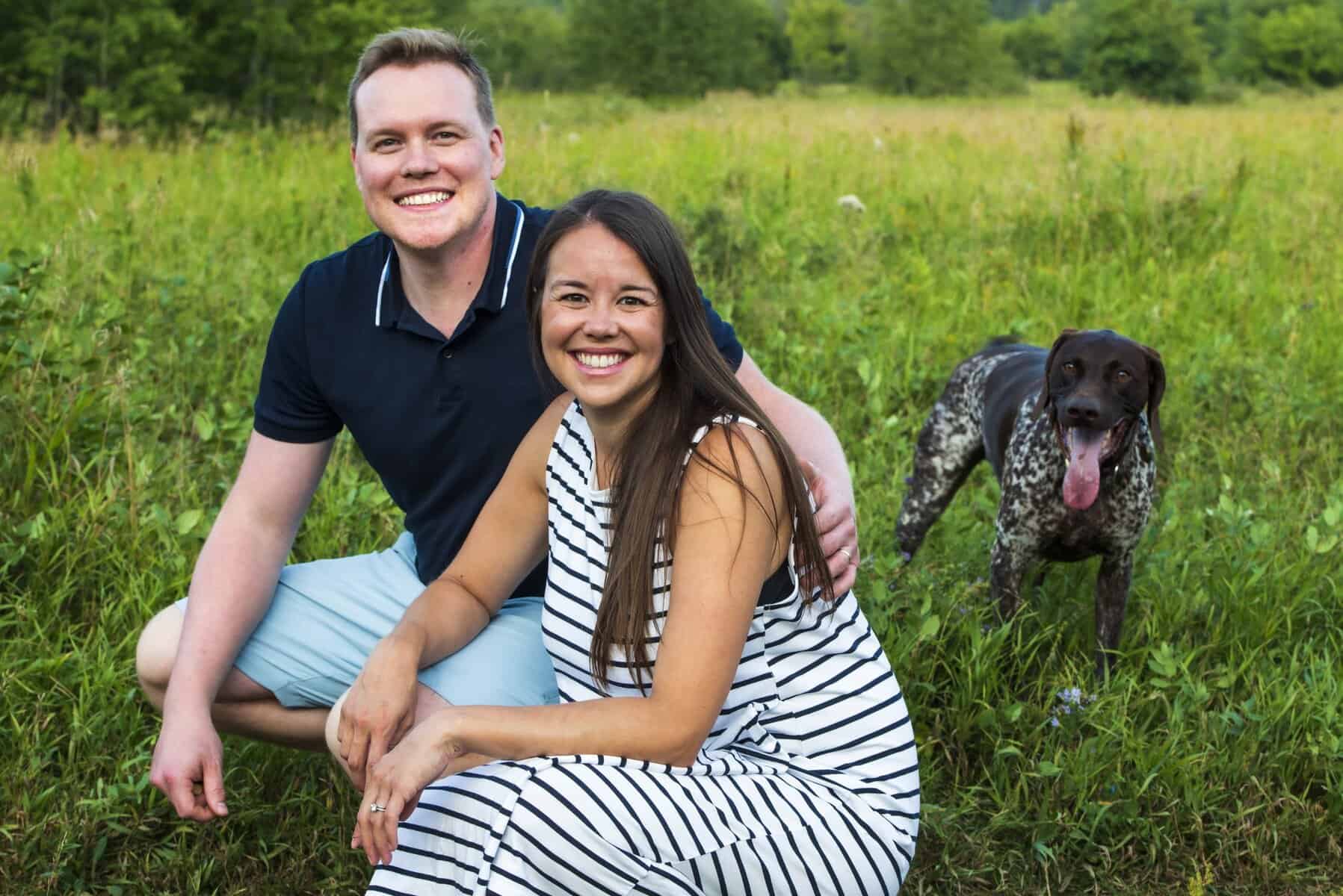 Dr. Adam Kinnaird with his wife and dog
