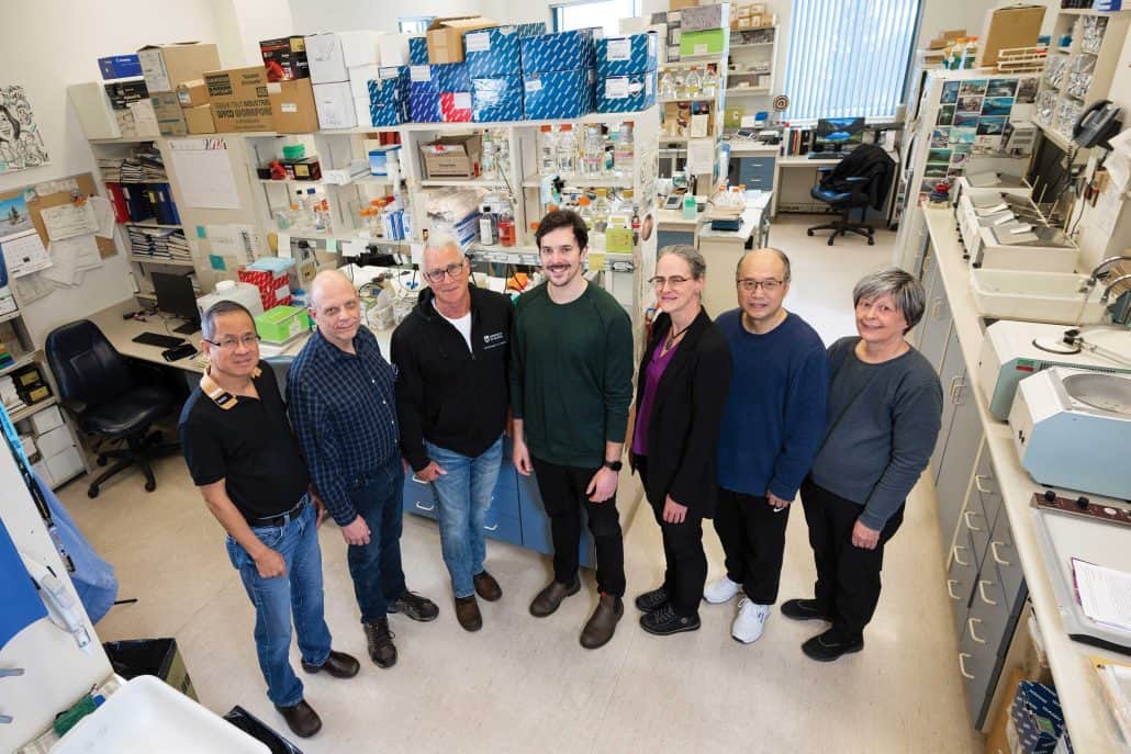 Team of medical professionals standing in a lab.