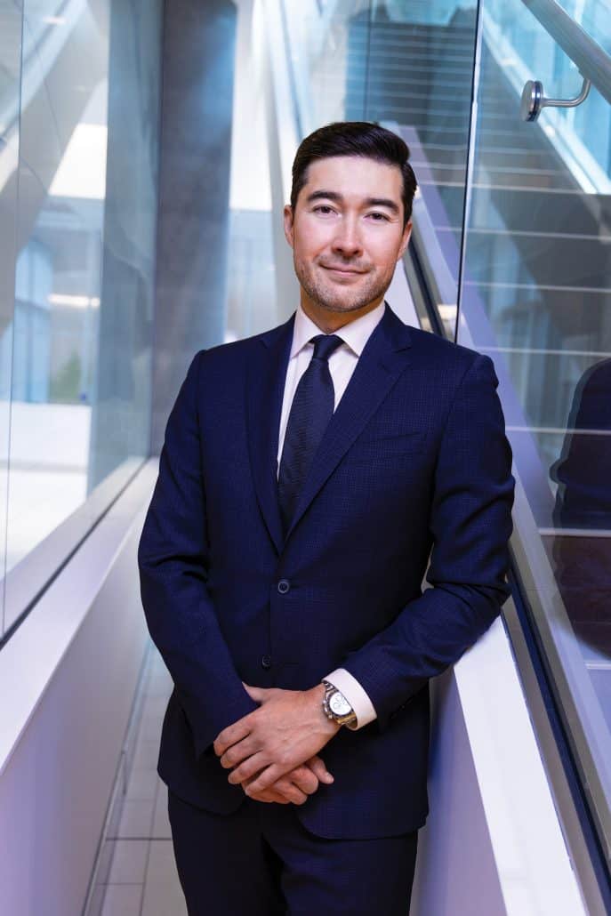 Man in suit with windows around him. 